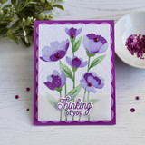 Handmade greeting card with flowers on it and thinking of you sentiment on it.