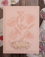 Handmade greeting card with flowers on it and with sympathy sentiment on it.