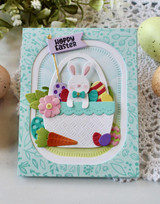 Handmade greeting card with a bunny on it in a basket and hoppy easter sentiment on it.