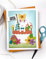 Handmade greeting card with a bunny on it in a basket and hoppy easter sentiment on it.