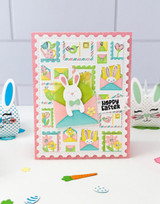 Handmade greeting card with springtime postage on it and bunny on it with hoppy easter sentiment on it.