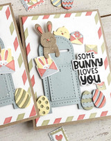 Handmade greeting card with springtime items on it and a bunny in a mailbox with some bunny loves you sentiment on it.