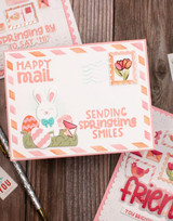 Handmade greeting card with springtime postage on it and happy mail, sending spring time smiles sentiment on it.
