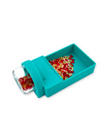Image of Tiny Diamonds - Tip 'n Tidy  laying on its side with gems inside it.