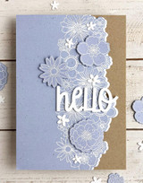 Handmade greeting card with flowers on it and hello sentiment on it.