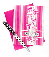Handmade greeting card with bows on it and congrats sentiment on it.