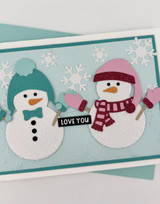 Handmade greeting card with two snowmen on it and love you sentiment on it.