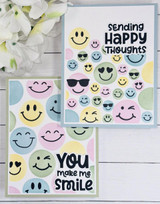 Two handmade greeting cards with smiley faces on each and different uplifting sentiments on each.