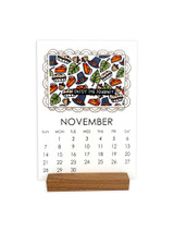 Handmade calendar with pie and pilgrim items on it for November.