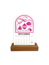 Handmade calendar with ornaments on it for the month of December.