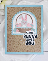 Handmade greeting card with leaves on it and a bunny with some bunny loves you sentiment on it.