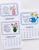 Three handmade calendars with quotes and flowers on each.