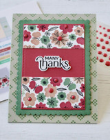 Handmade greeting card with flowers on it and many thanks sentiment on it.