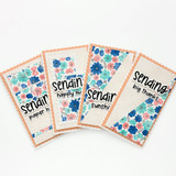 Four handmade greeting cards with flowers on it and various sentiments on it.