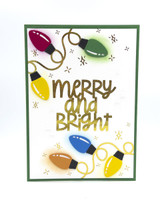 Handmade greeting card with light bulbs on it and merry and bright sentiment on it.