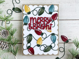 Handmade greeting card with light bulbs on it and merry and bright sentiment on it.