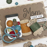 Handmade greeting card with buttons on it and mom I love you sew much sentiment on it.