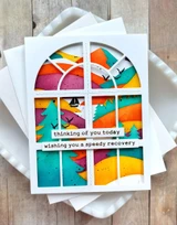 Handmade greeting card with window on it and thinking of you, wishing you a speedy recovery sentiment on it.