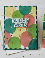 Handmade greeting card with balloons on it and birthday wishes sentiment on it.
