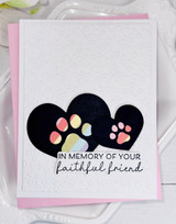 Handmade greeting card with paw prints on it and in memory of your faithful friend sentiment on it.