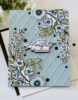 Handmade greeting card with flowers on it and with heartfelt sympathy sentiment on it.