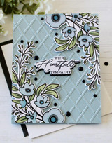Handmade greeting card with flowers on it and with heartfelt sympathy sentiment on it.