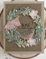 Handmade greeting card with leaves on it and a bird with just because sentiment on it.