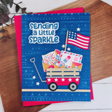 Handmade greeting card with wagon on it and sending a little sparkle sentiment on it.