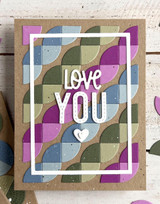 Handmade greeting card with circle patterns on it and love you sentiment on it.