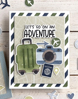 Handmade greeting card with luggage on it and let's go on an adventure sentiment on it.