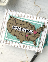 Handmade greeting card with US on it and missing you sentiment on it.