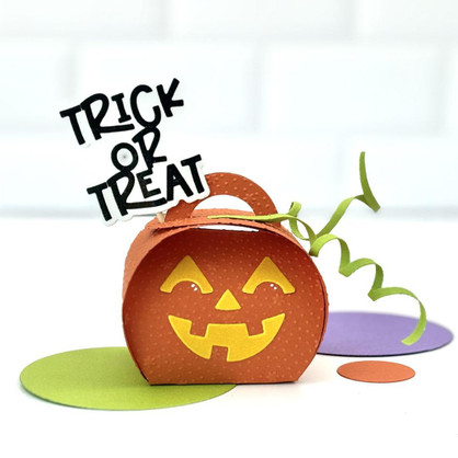 Handmade gift box that looks like a pumpkin with trick or treat sentiment on it.