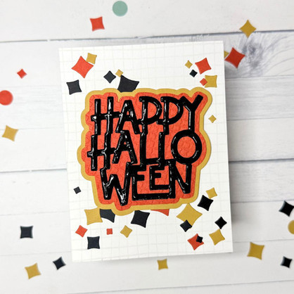 Handmade greeting card with sparkles on it and happy Halloween sentiment on it.