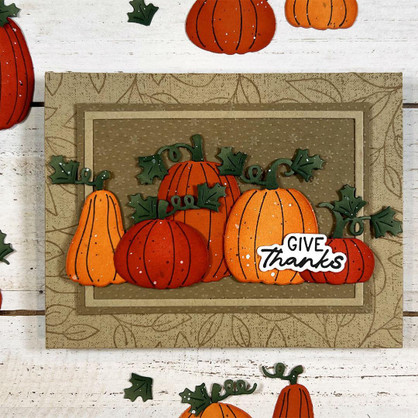 Handmade greeting card with pumpkins on it and give thanks sentiment on it.