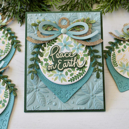 Handmade greeting card with peace on earth sentiment on it.