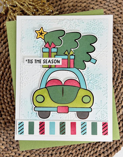 Handmade greeting card with car and Christmas tree with 'tis the season sentiment on it.