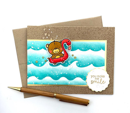 Handmade greeting card of bear in pool floaty with you make me smile sentiment on it.