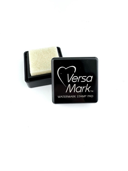 Image of VersaMark Watermark Mini stamp pad that is opened up to show the ink, used for papercrafting. Image of VersaMark Watermark Mini stamp pad that is opened up to show the ink, used for papercrafting.