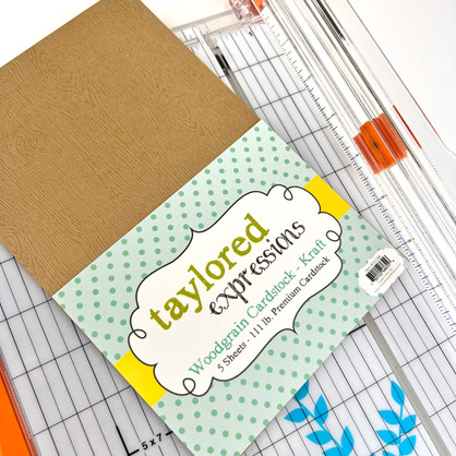 Image of Woodgrain Cardstock - Kraft in its packaging which is a brown cardstock.