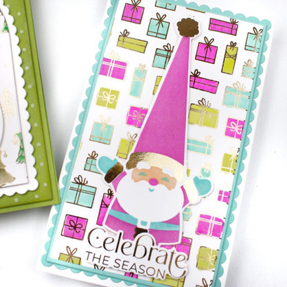 Handmade greeting card with santa on it and presents with celebrate the season sentiment on it.