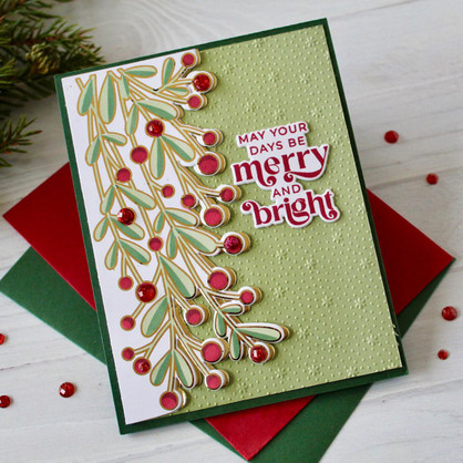 Handmade greeting card with mistletoe on it and may your days be merry and bright sentiment on it.