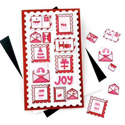 Handmade greeting card with Christmas postage stamps on it and joy sentiment on it.