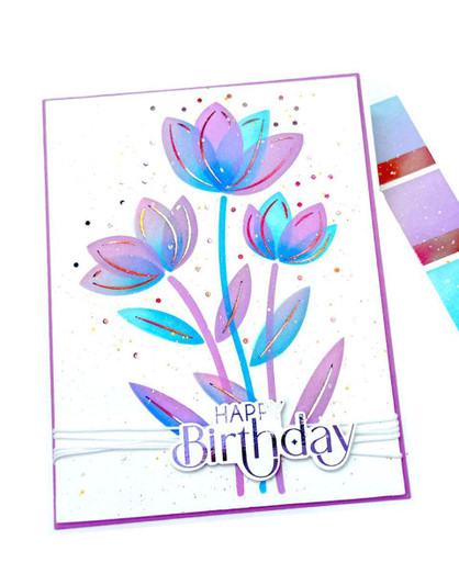 Handmade greeting card with flowers on it and happy birthday sentiment on it.