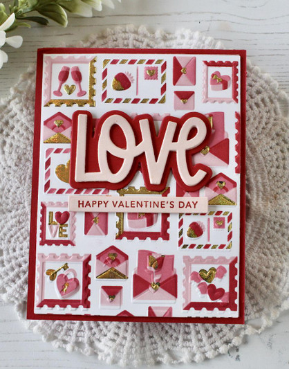 Handmade greeting card with postmarked heart and love envelopes with love sentiment on it.