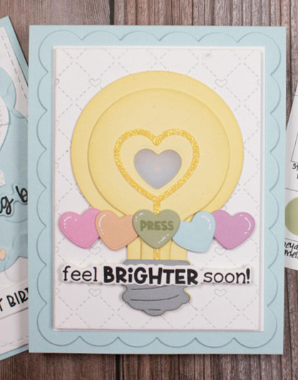Handmade greeting card with a light bulb on it and feel brighter soon sentiment on it with press button on it.