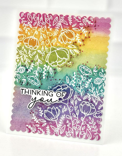 Handmade greeting card with flowers on it and thinking of you sentiment on it.