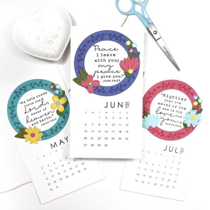 Three handmade calendars with bible verse on each inside a leaf wreath.