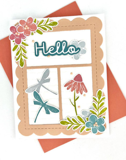 Handmade greeting card with flowers on it and dragon flies with hello sentiment on it.