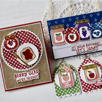 Two handmade greeting cards with jam on each and two tags with jam on each.