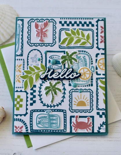 Handmade greeting card with summer beach themed items on it and hello sentiment on it.